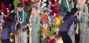 Mujer besa la mano de novio y esposa la desgreña