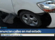 Conductor resulta con daños en su auto tras caer en bache en Apodaca