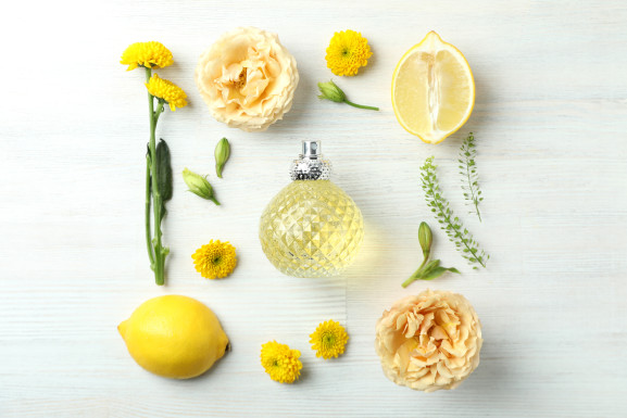 Composition with bottle of perfume and ingredients